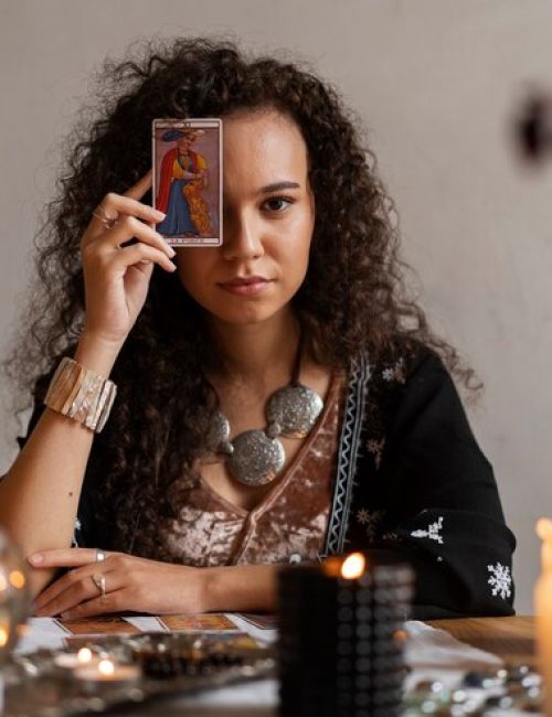 medium-shot-woman-reading-tarot-home_23-2150273203